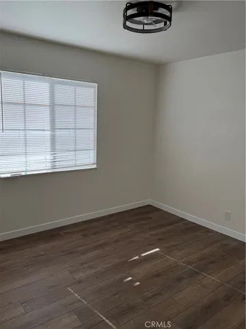 a view of a livingroom with wooden floor