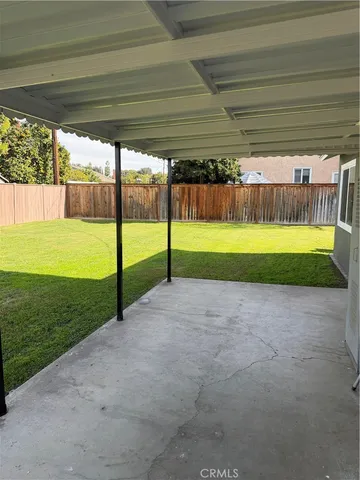 a view of a yard with porch and entertaining space