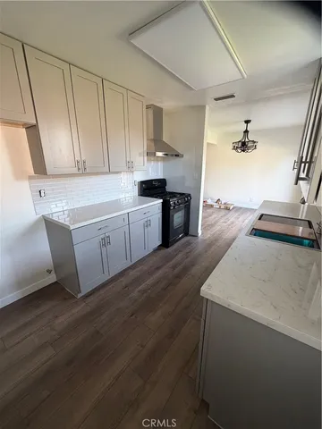 a kitchen with sink cabinets and window