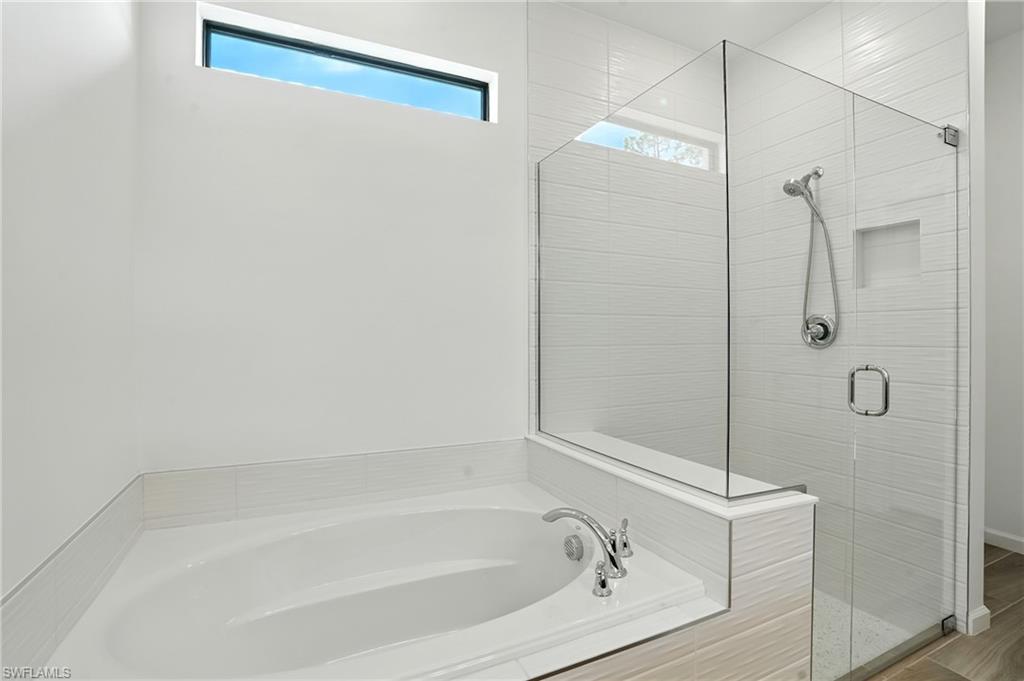 2003 Don Benito Way Naples, FL 34120 - Photo 20 of 45 a bathroom with a bathtub and shower