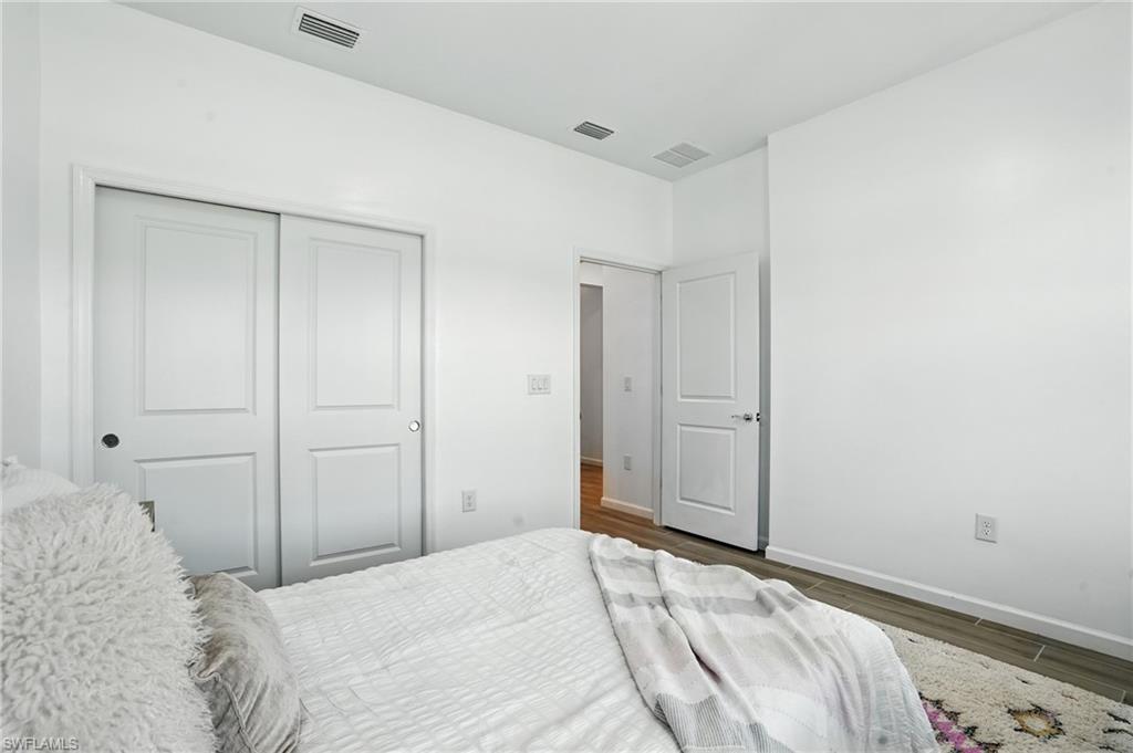 2003 Don Benito Way Naples, FL 34120 - Photo 26 of 45 a bedroom with a bed and a bathroom