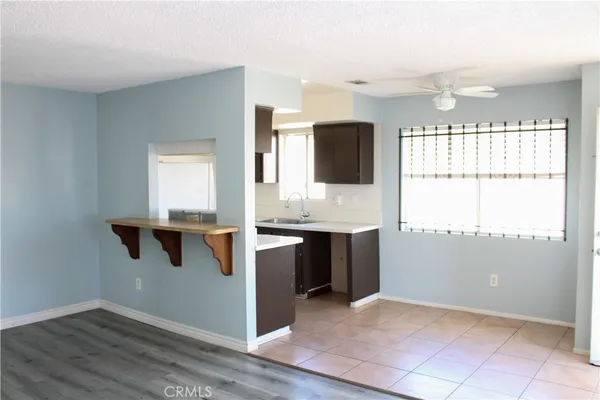 a kitchen with a refrigerator and a stove