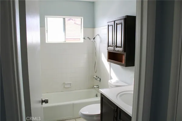 a bathroom with a sink a toilet and a bathtub