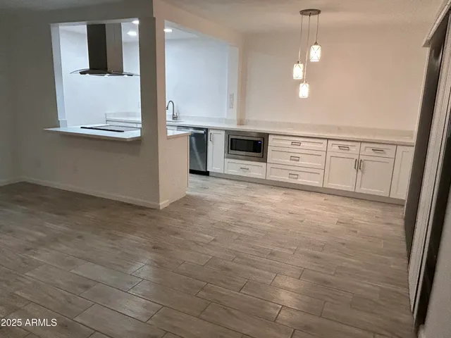a view of a kitchen with electric equipment