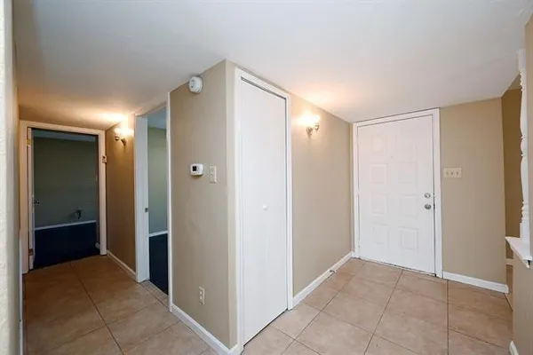 a view of a hallway with closet area