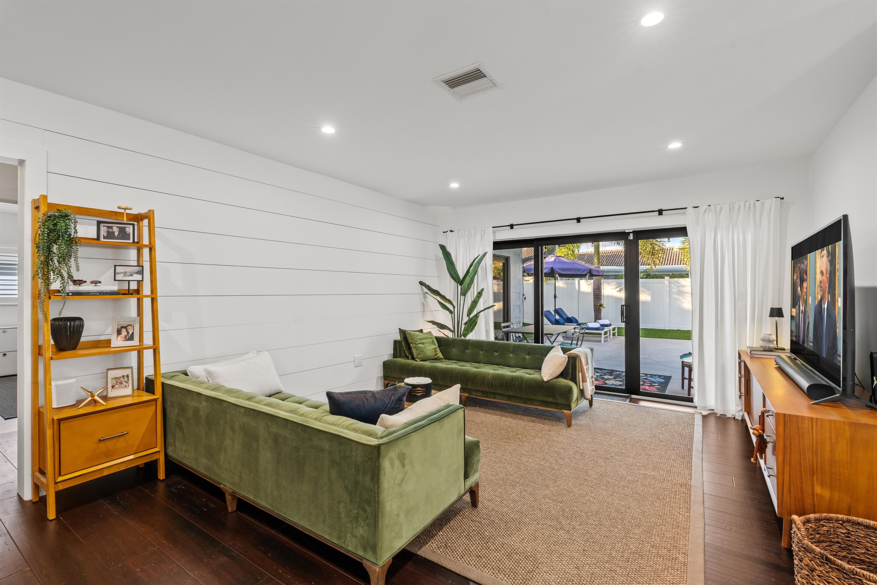 833 Northwest 6th Terrace Boca Raton, FL 33486 - Photo 12 of 49 a living room with furniture and a flat screen tv