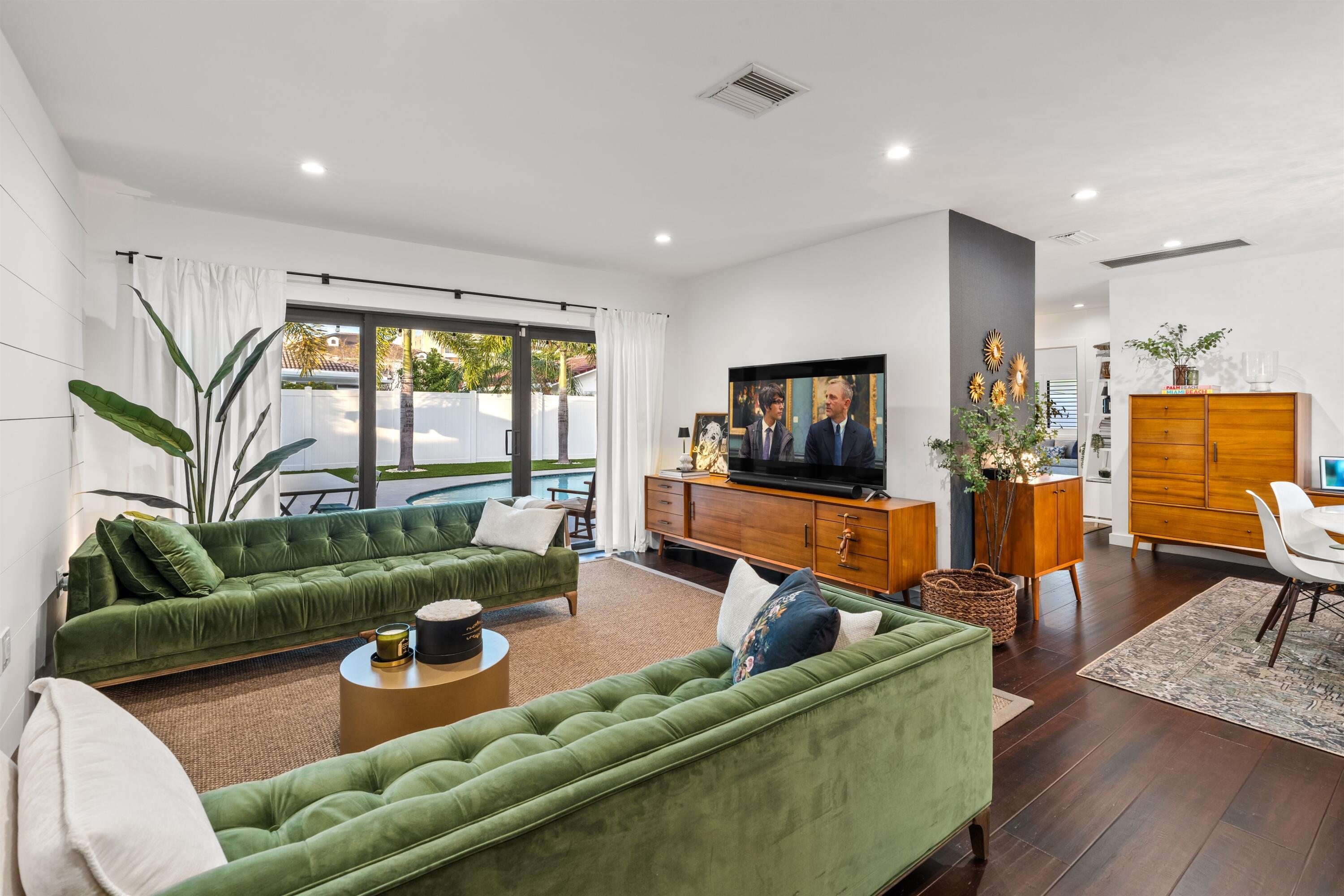 833 Northwest 6th Terrace Boca Raton, FL 33486 - Photo 13 of 49 a living room with furniture and a flat screen tv