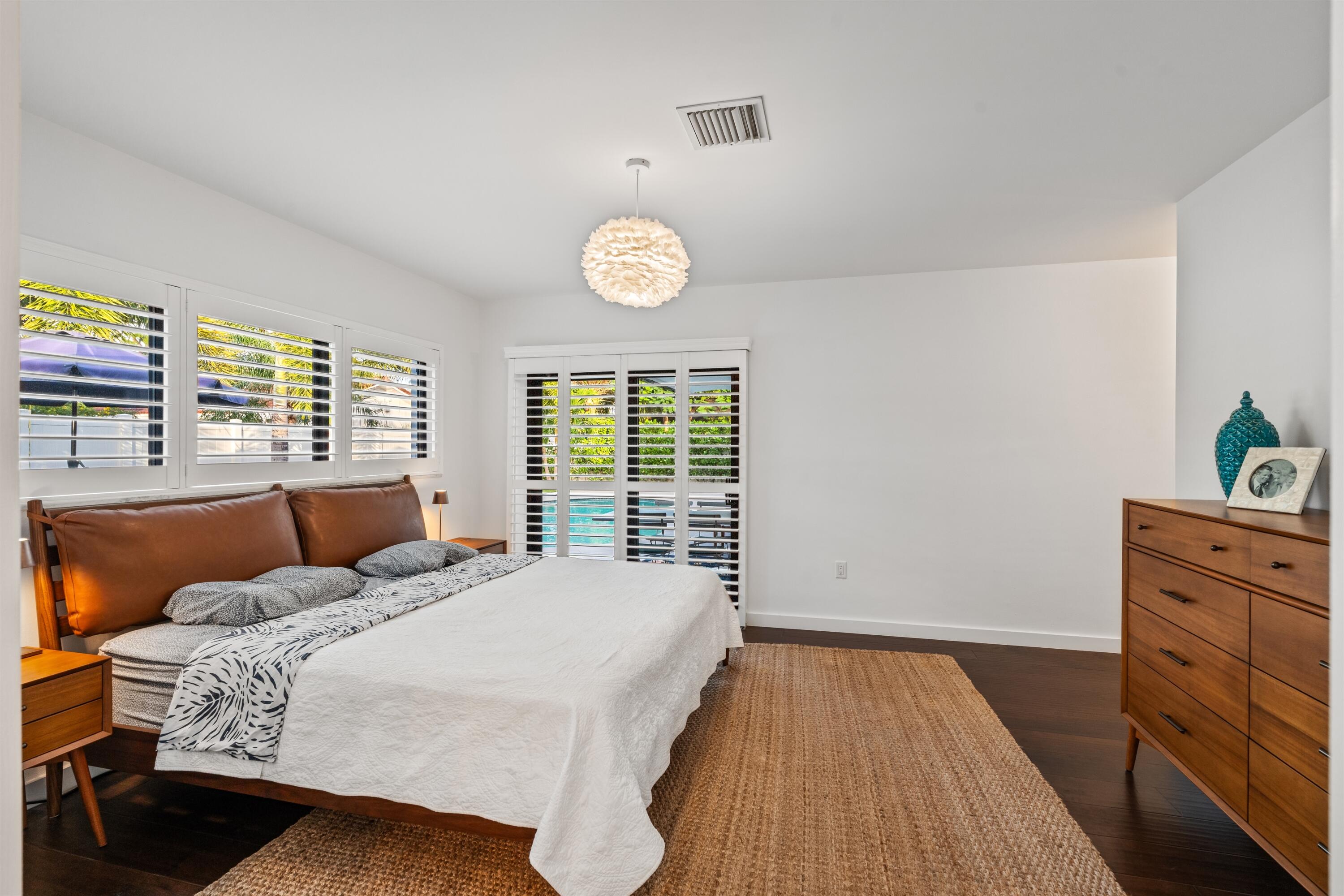 833 Northwest 6th Terrace Boca Raton, FL 33486 - Photo 18 of 49 a bedroom with a bed and a window