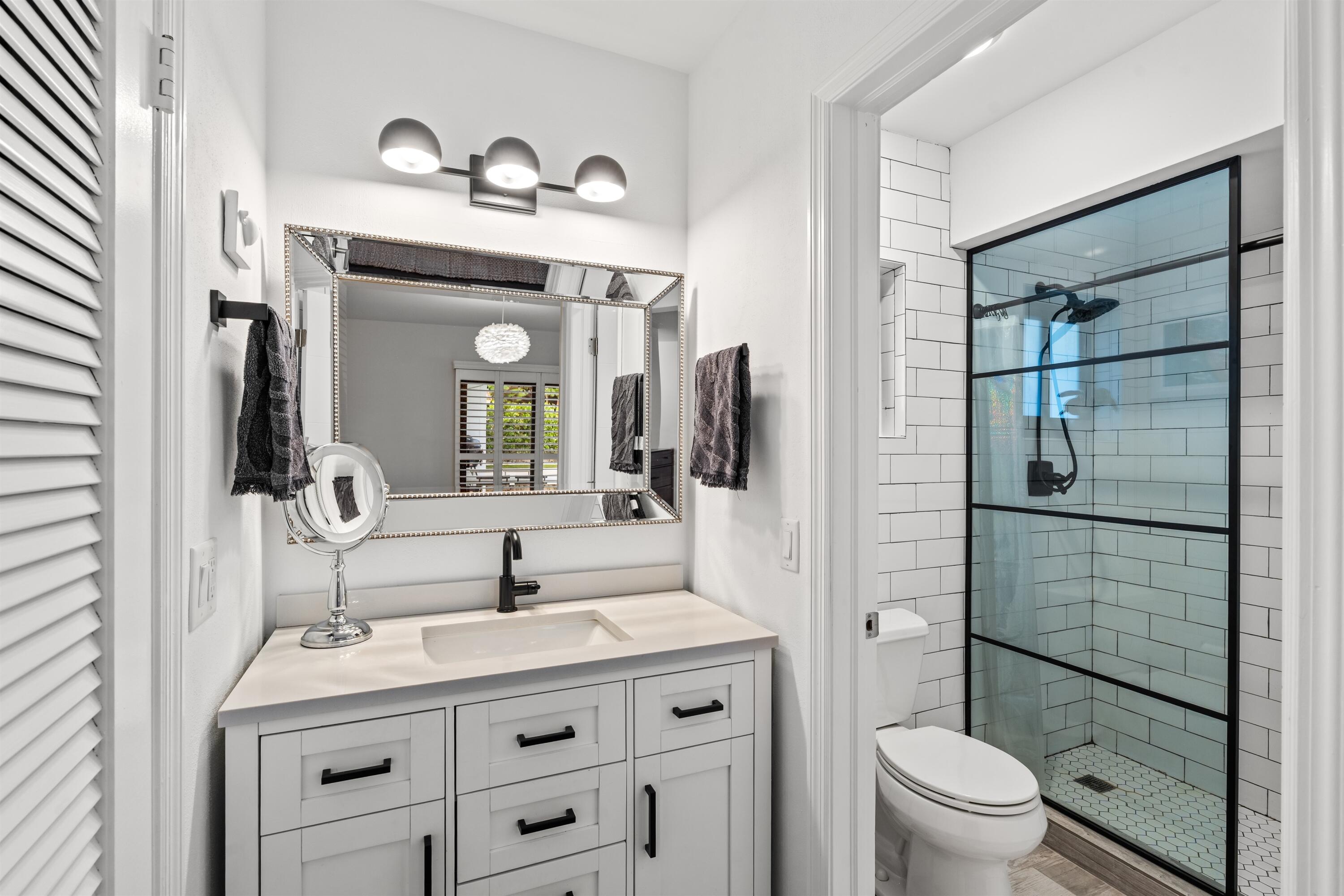 833 Northwest 6th Terrace Boca Raton, FL 33486 - Photo 20 of 49 a bathroom with a granite countertop sink toilet and shower