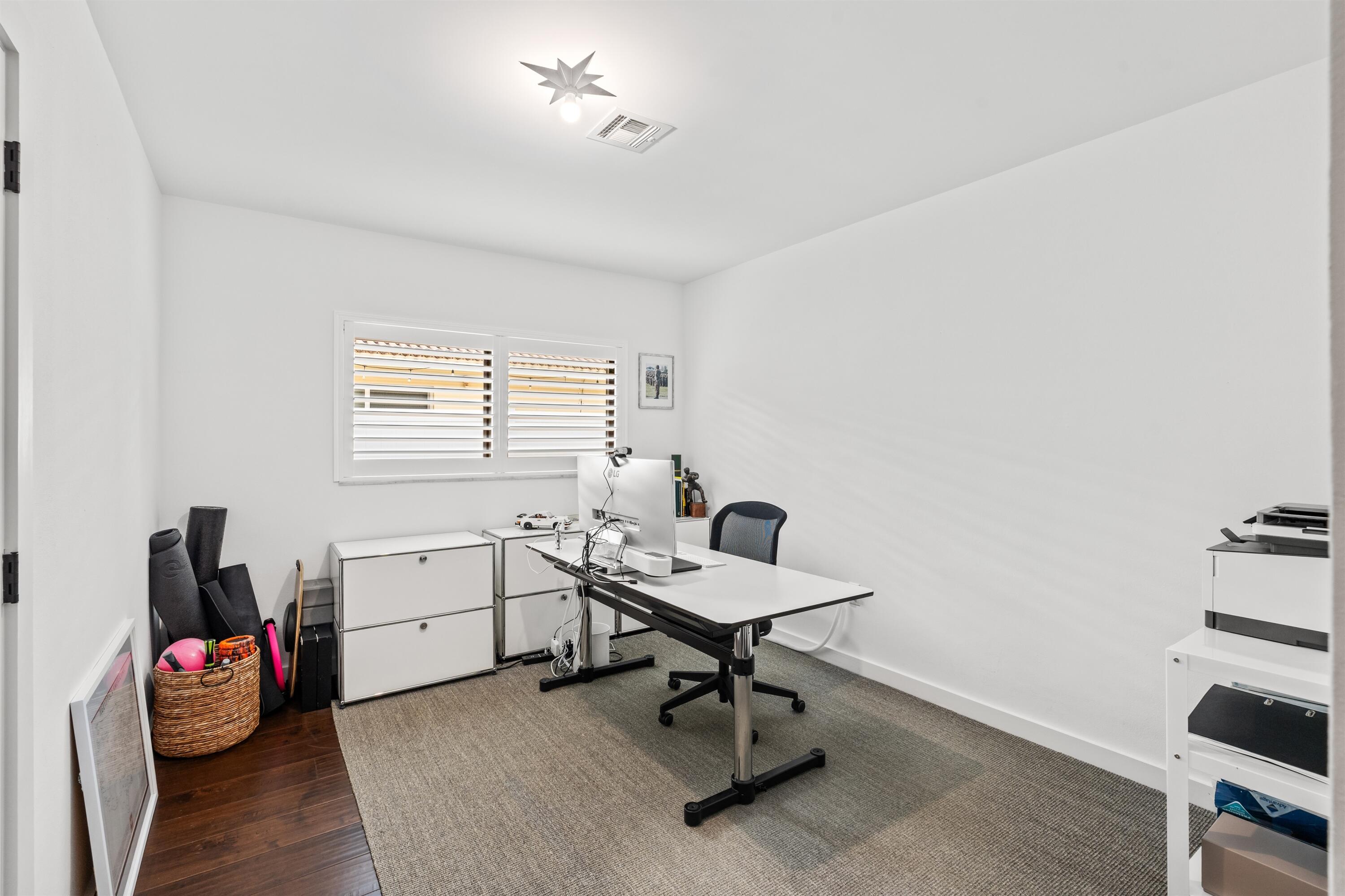 833 Northwest 6th Terrace Boca Raton, FL 33486 - Photo 21 of 49 a view of a workspace with furniture and a window