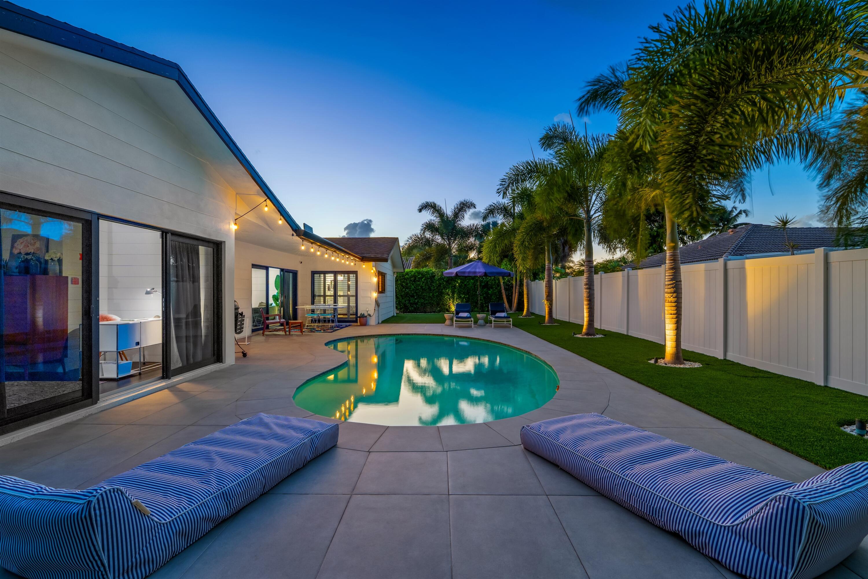 833 Northwest 6th Terrace Boca Raton, FL 33486 - Photo 27 of 49 a view of a house with backyard and sitting area