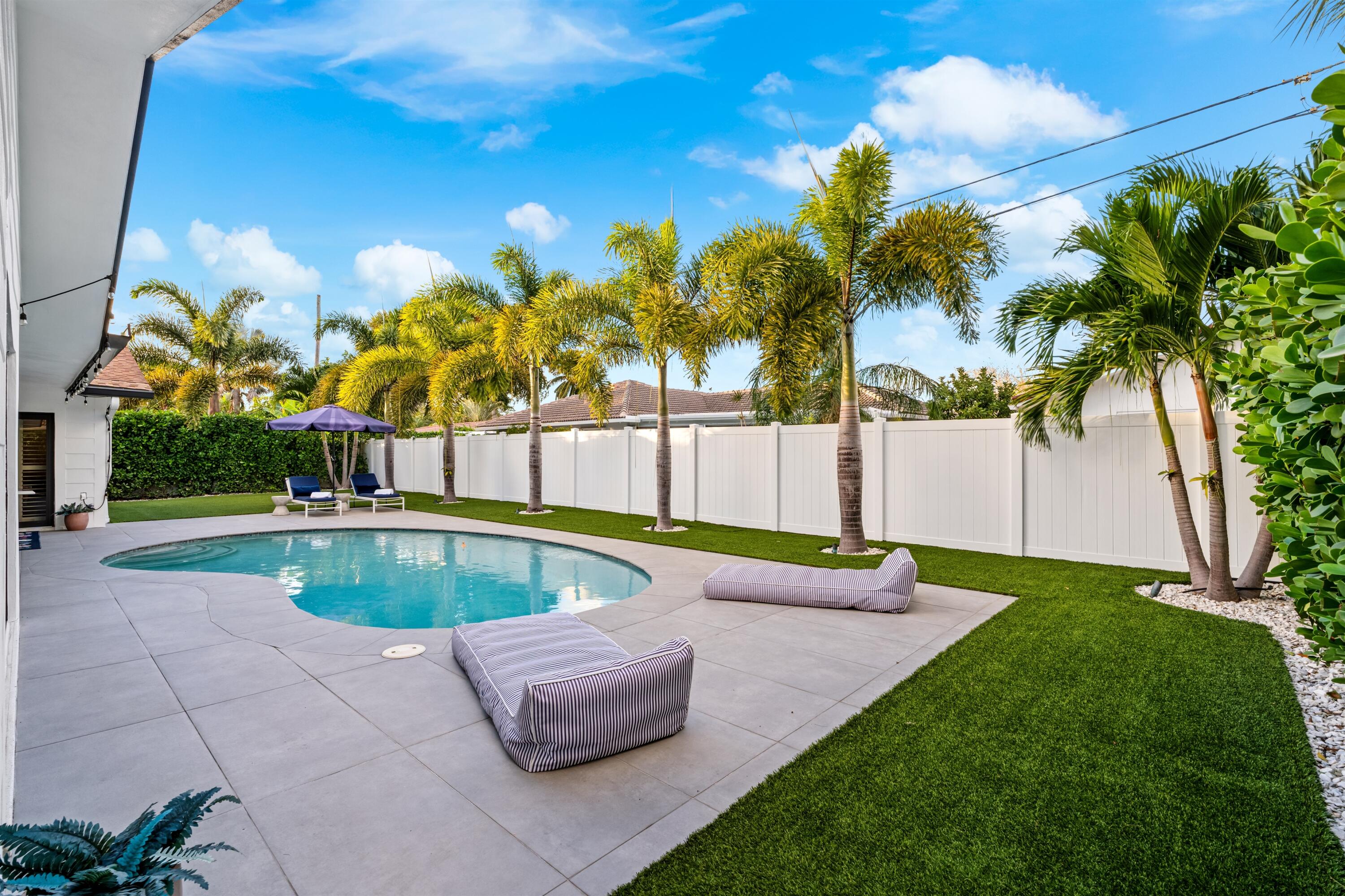 833 Northwest 6th Terrace Boca Raton, FL 33486 - Photo 30 of 49 a view of a backyard with swimming pool