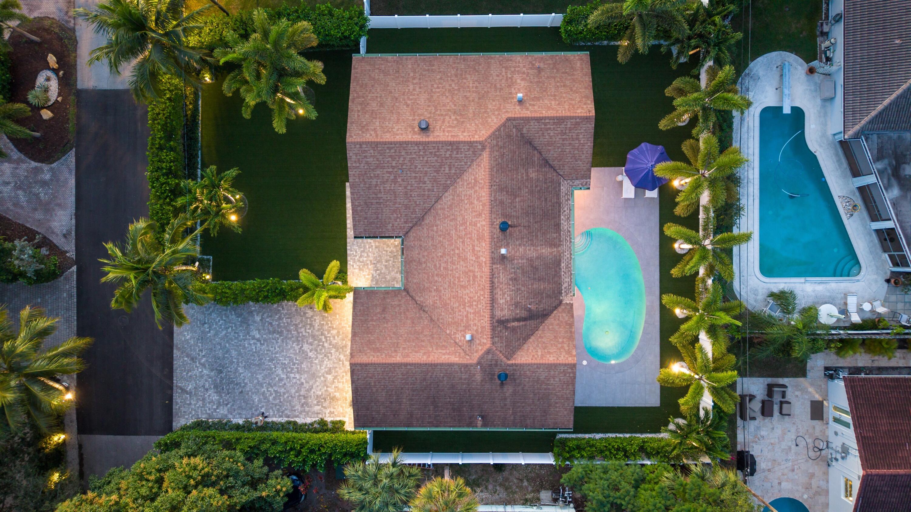 833 Northwest 6th Terrace Boca Raton, FL 33486 - Photo 47 of 49 an aerial view of a house with a yard and a large pool