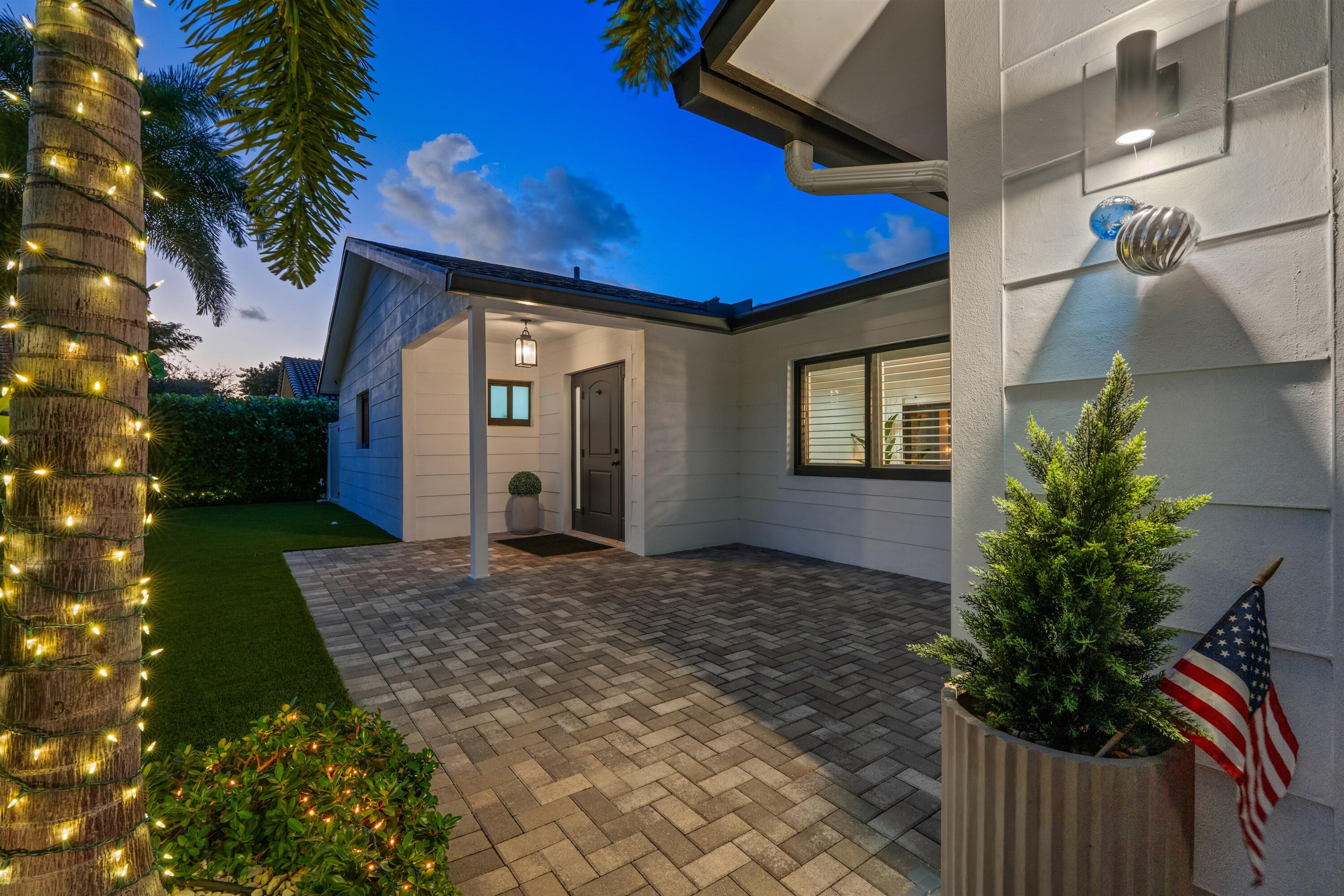 833 Northwest 6th Terrace Boca Raton, FL 33486 - Photo 6 of 49 a view of a house with a yard