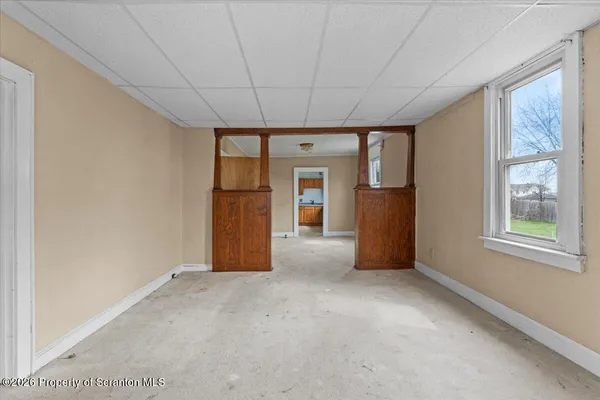 a view of an empty room with a window