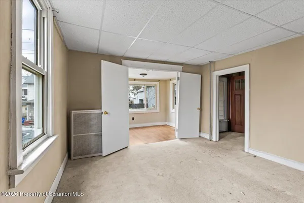 a view of livingroom with furniture and front door