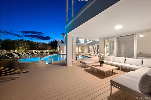 a view of a swimming pool with an outdoor seating