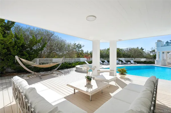 a view of a swimming pool with a lounge chairs