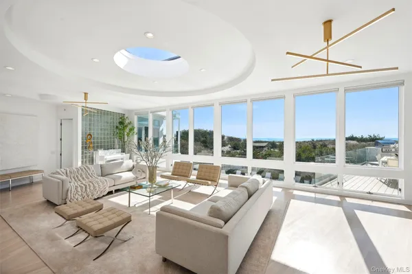 a living room with furniture fireplace and flat screen tv