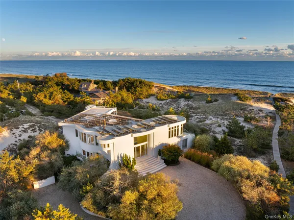 a view of a house with a ocean view