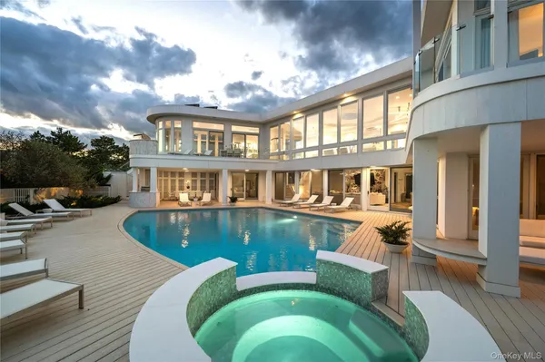 a view of a patio with swimming pool table and chairs