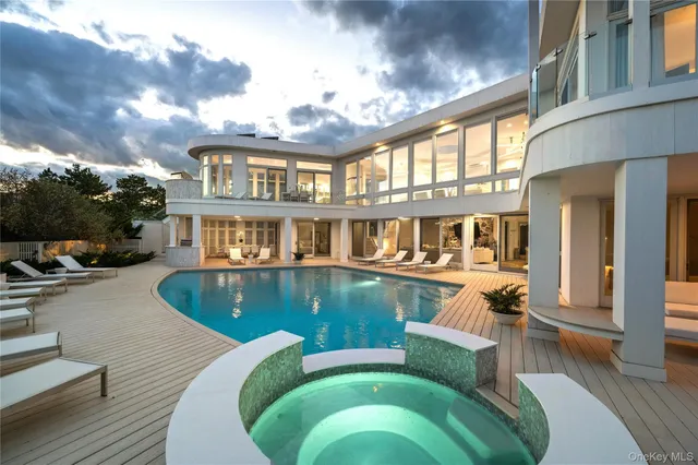 a view of a patio with swimming pool table and chairs