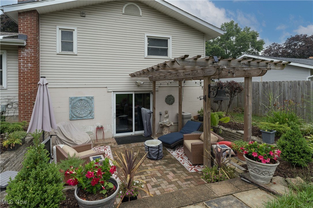 2856 Shellhart Road Barberton, OH 44203 - Photo 8 of 27 Rear view of house featuring a pergola and a patio area