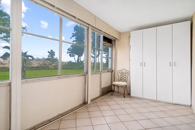 a view of a livingroom with furniture and window