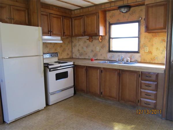 61 Gauthier Road Petersham, MA 01366 - Photo 5 of 7 a kitchen with a sink a stove and refrigerator