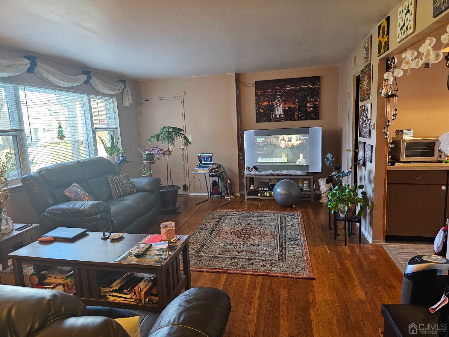 183 Evergreen Road, Unit 6A Edison, NJ 08837 - Photo 11 of 23 a living room with furniture and a flat screen tv