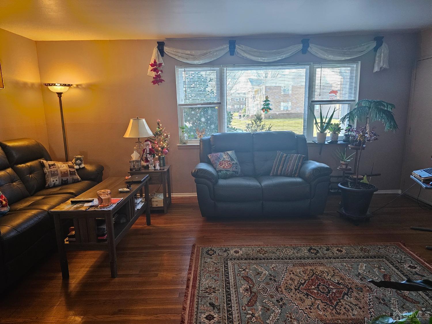 183 Evergreen Road, Unit 6A Edison, NJ 08837 - Photo 12 of 23 a living room with furniture window and wooden floor