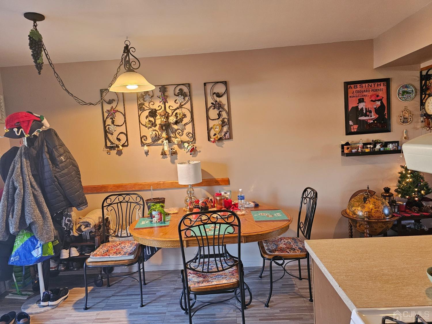 183 Evergreen Road, Unit 6A Edison, NJ 08837 - Photo 13 of 23 a dining room with furniture and wooden floor