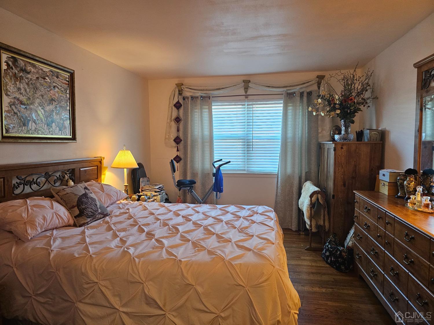 183 Evergreen Road, Unit 6A Edison, NJ 08837 - Photo 17 of 23 a bedroom with a bed and wooden floor