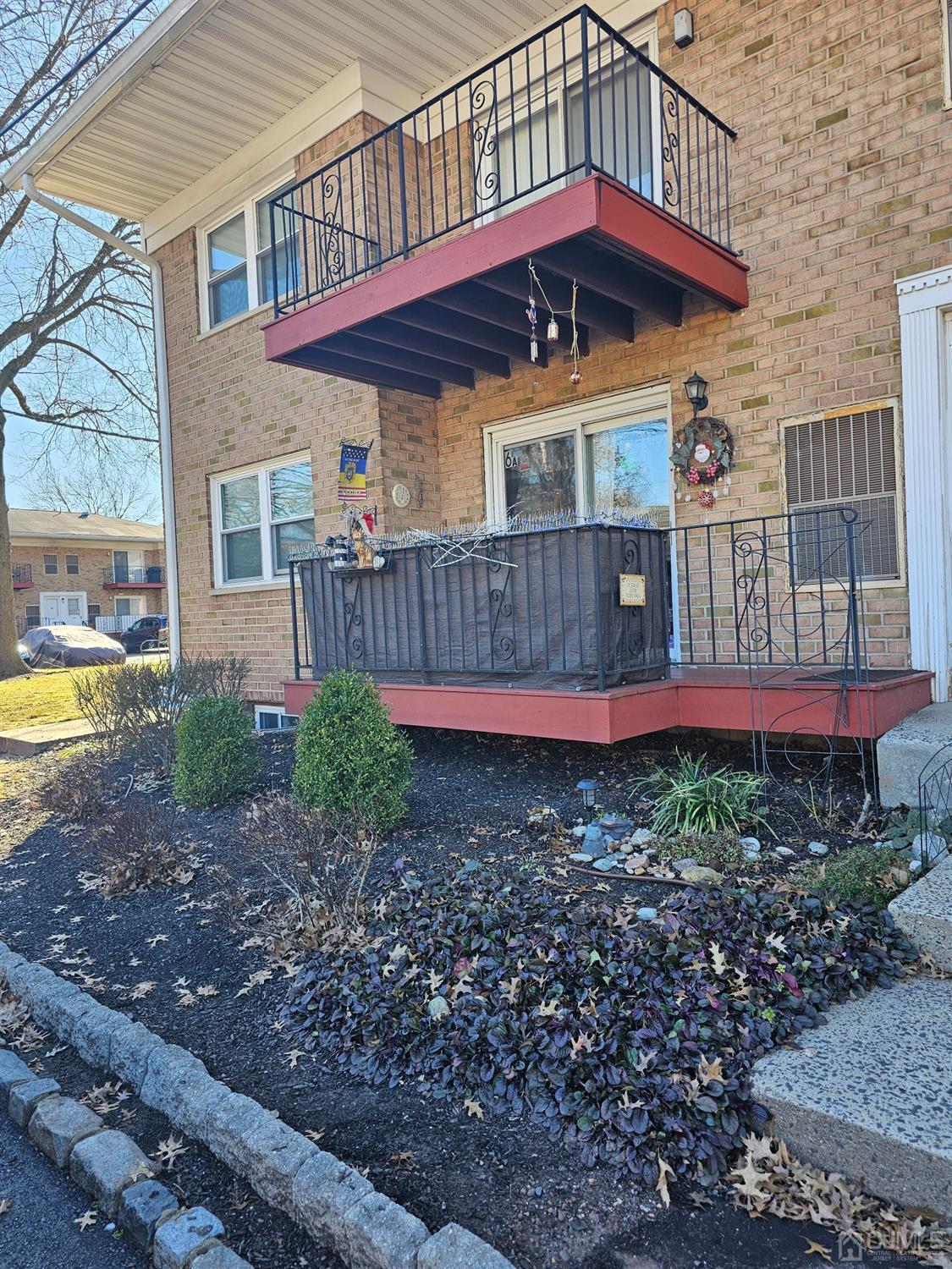 183 Evergreen Road, Unit 6A Edison, NJ 08837 - Photo 22 of 23 a view of a house with a yard