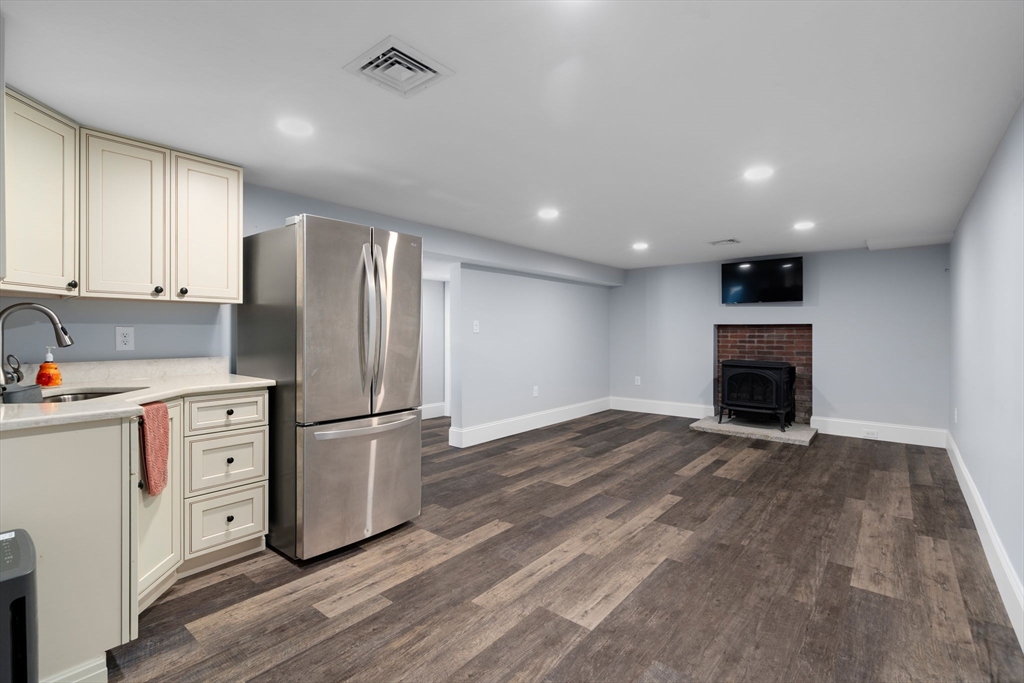 173 Putnam Hill Road Sutton, MA 01590 - Photo 17 of 42 a view of kitchen appliances and cabinets with wooden floor