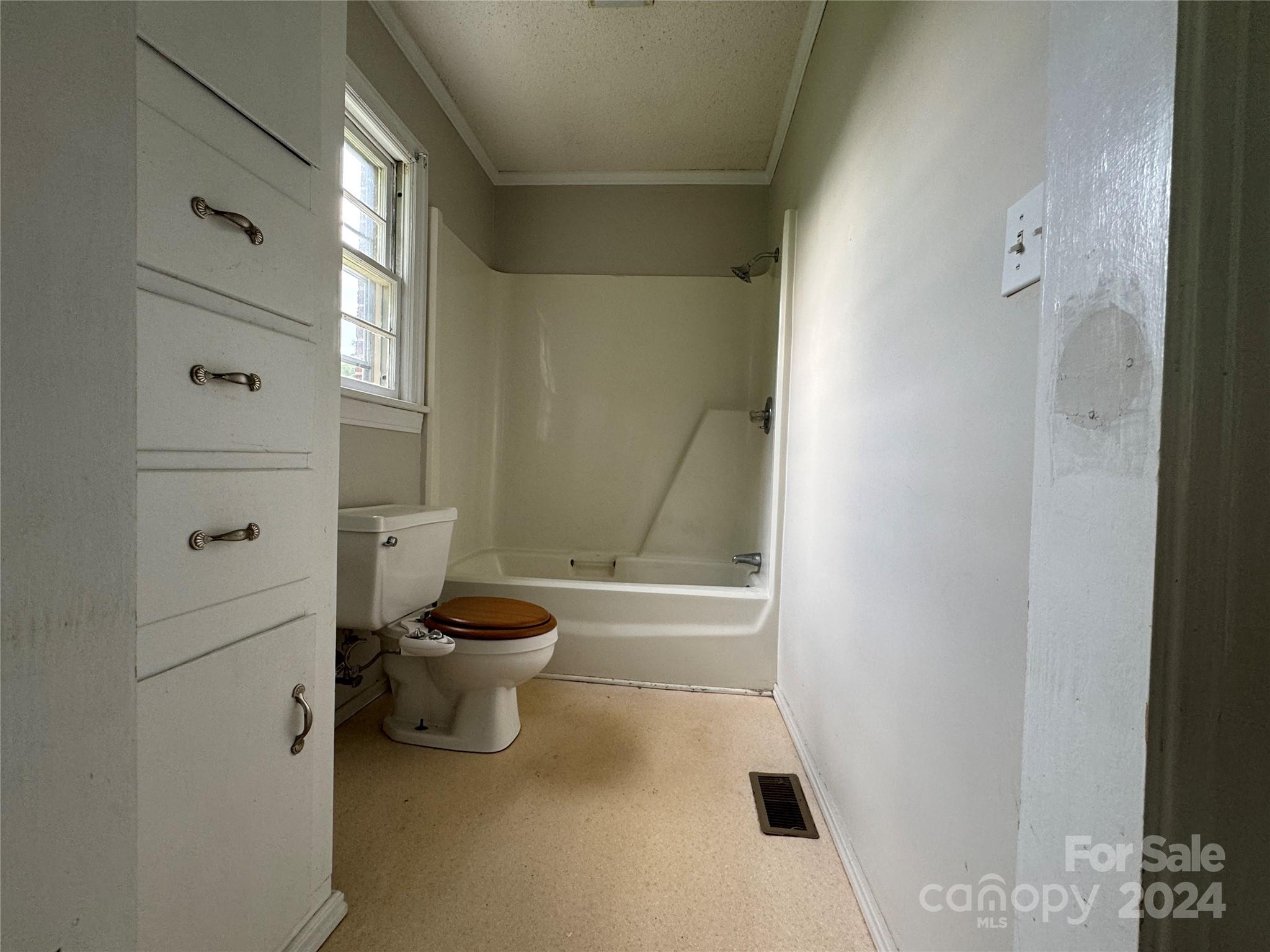 1555 Lower Palmer Road Rockwell, NC 28138 - Photo 12 of 17 a bathroom with a granite countertop toilet and a shower