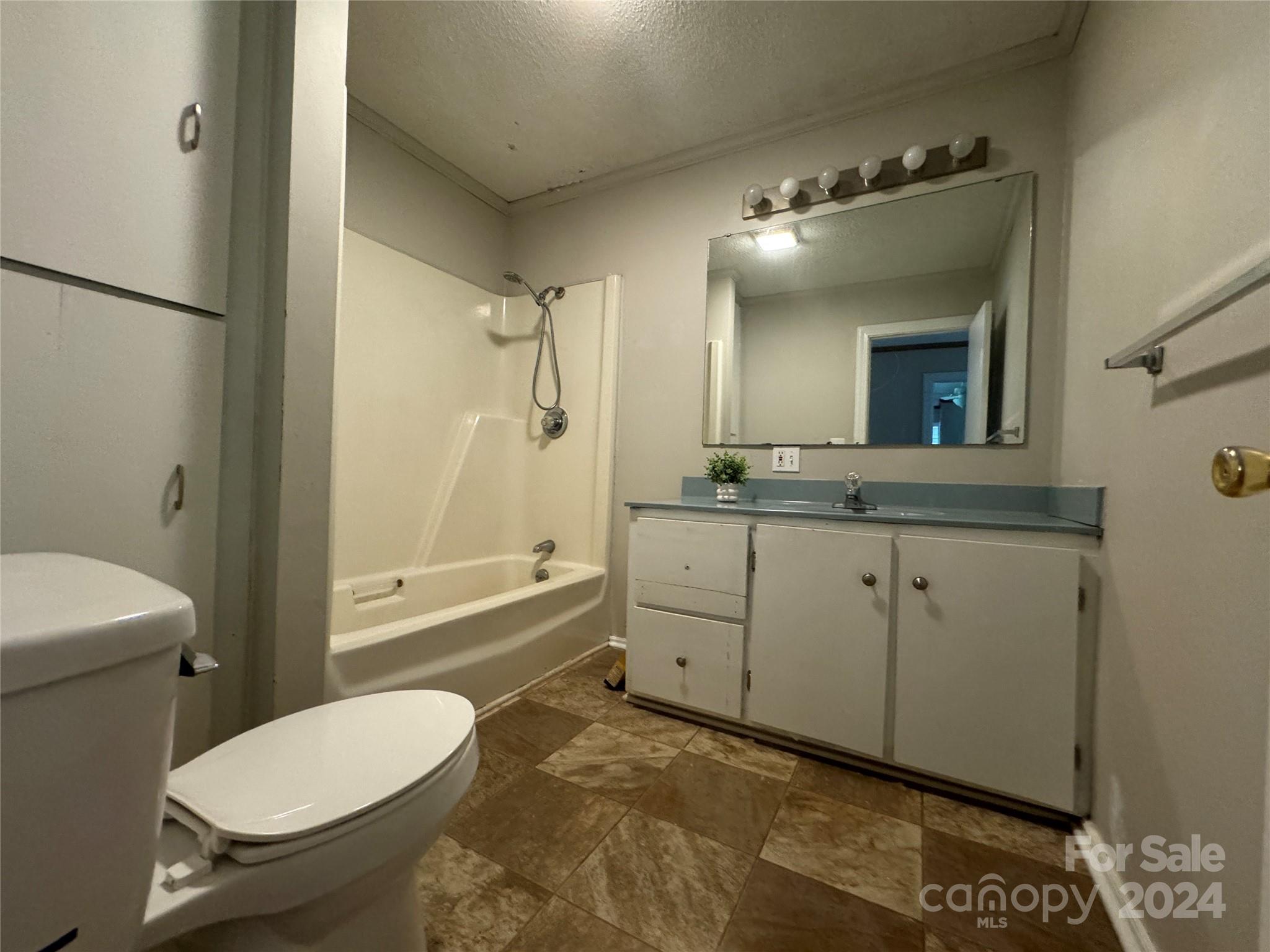 1555 Lower Palmer Road Rockwell, NC 28138 - Photo 15 of 17 a bathroom with a toilet a sink and mirror