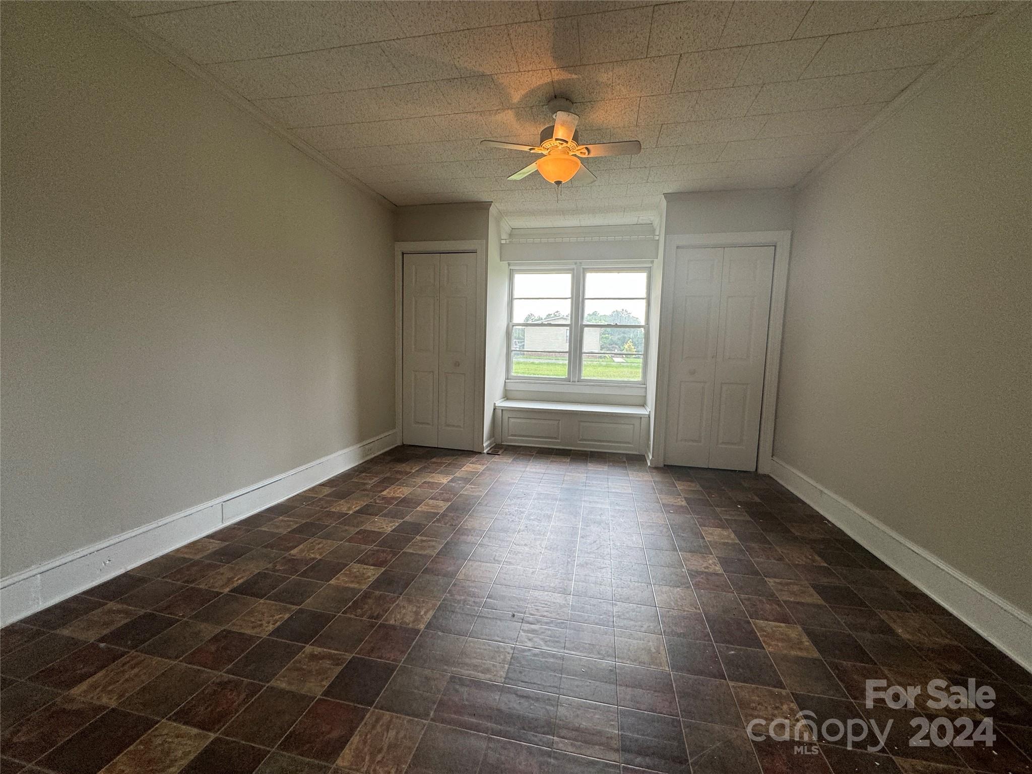 1555 Lower Palmer Road Rockwell, NC 28138 - Photo 16 of 17 an empty room with a empty space and windows