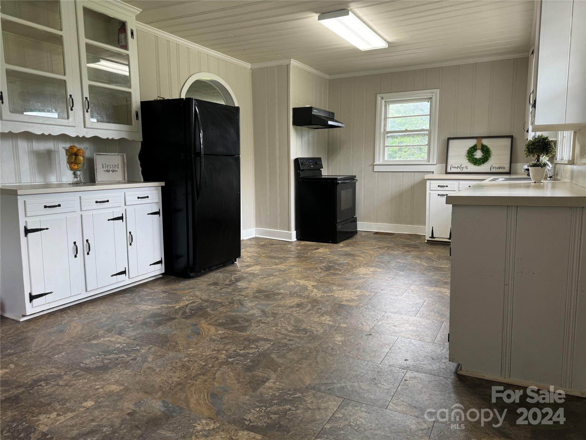 1555 Lower Palmer Road Rockwell, NC 28138 - Photo 5 of 17 a kitchen with stainless steel appliances a refrigerator and cabinets