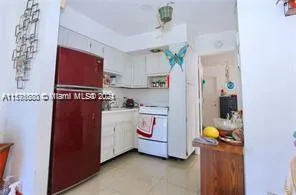 a utility room with cabinets washer and dryer