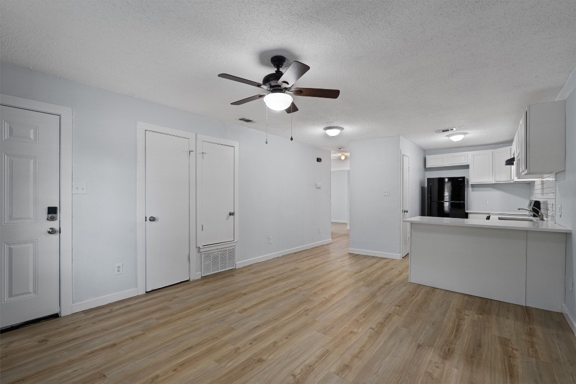 520 Lenora Drive, Unit A Taylor, TX 76574 - Photo 2 of 24 a view of a kitchen with wooden floor and a kitchen