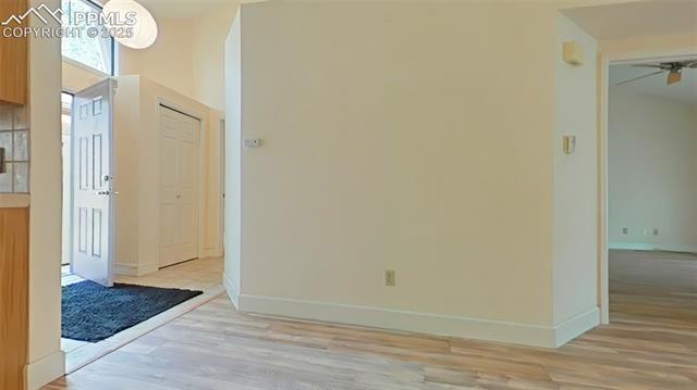 460 Autumn Ridge Circle, Unit D Colorado Springs, CO 80906 - Photo 16 of 38 Unfurnished room featuring ceiling fan, light wood-style flooring, and baseboards