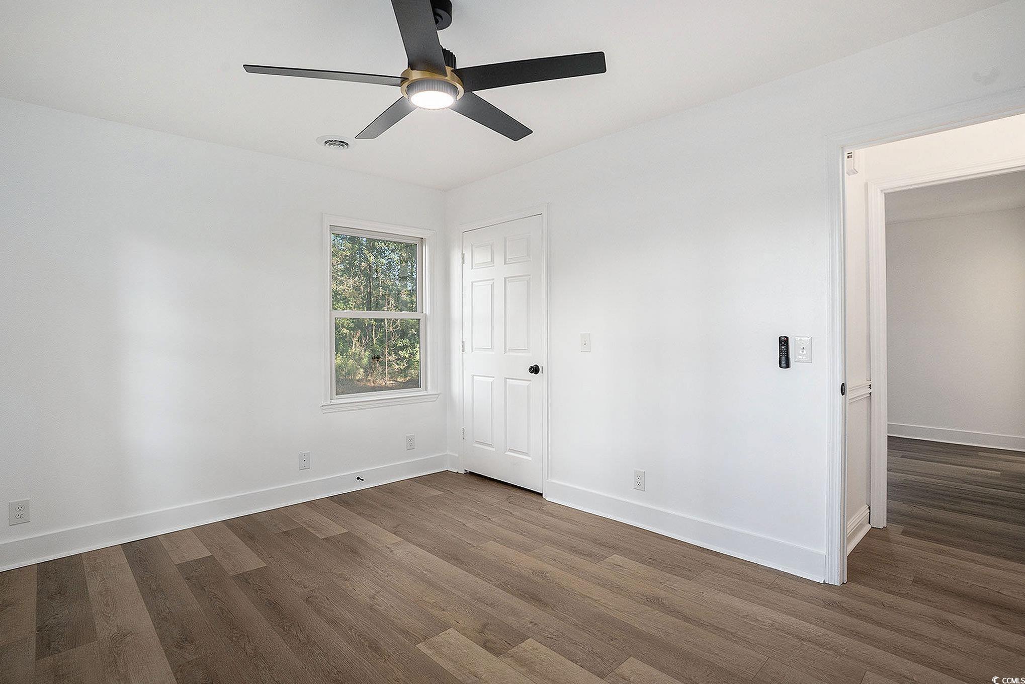 494 Ray Road Hemingway, SC 29554 - Photo 19 of 26 Unfurnished bedroom featuring dark wood-style flooring and a ceiling fan
