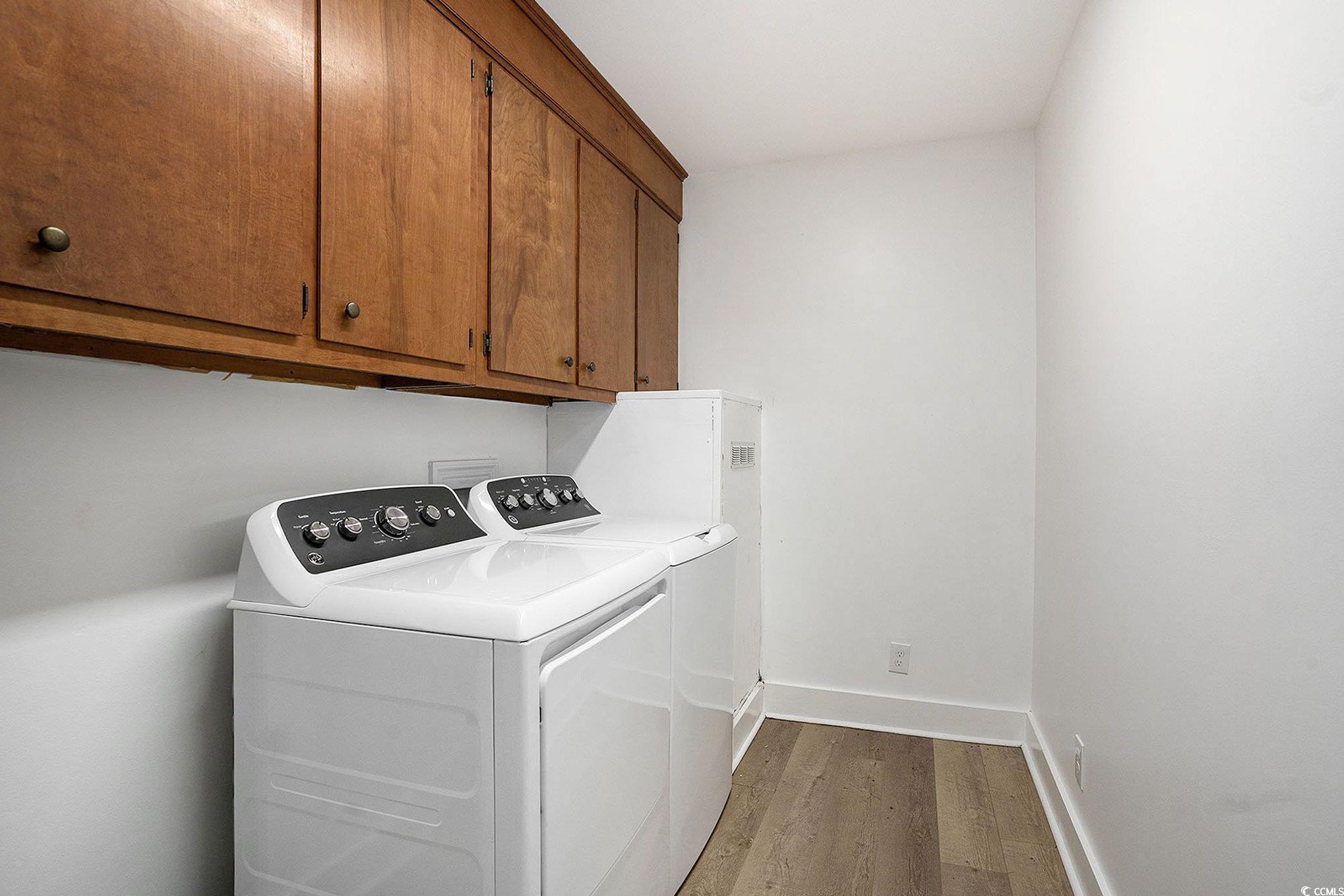 494 Ray Road Hemingway, SC 29554 - Photo 23 of 26 Laundry room with light wood-style floors, cabinet space, and independent washer and dryer