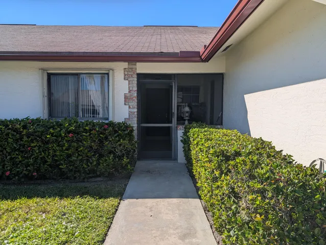 a view of entryway with flower pots