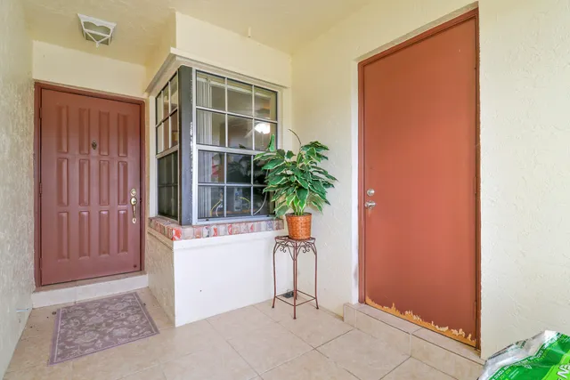 a view of entryway with wooden floor and a potted plant