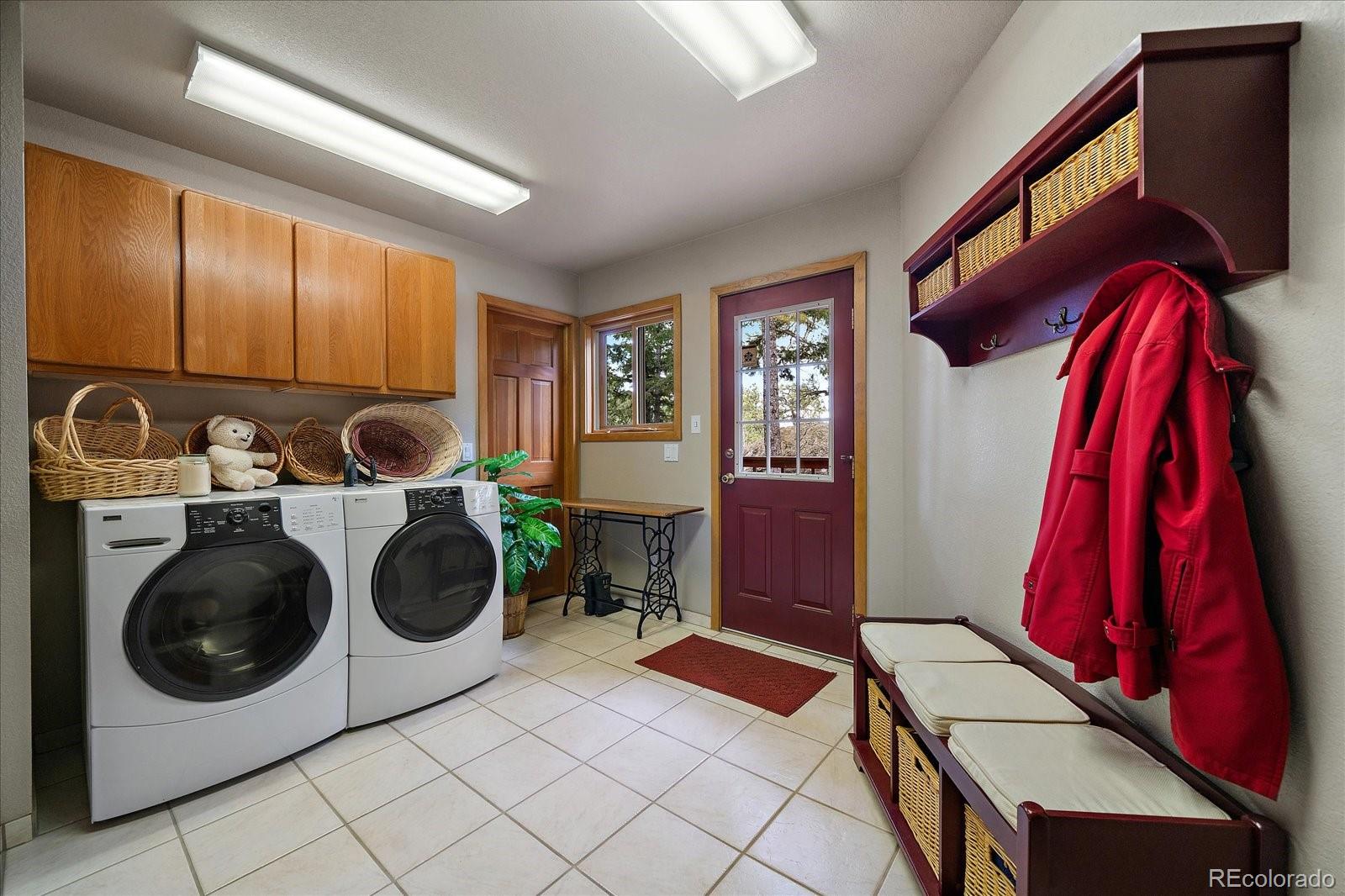 19791 Maxwell Drive Morrison, CO 80465 - Photo 22 of 50 a utility room with dryer and washer