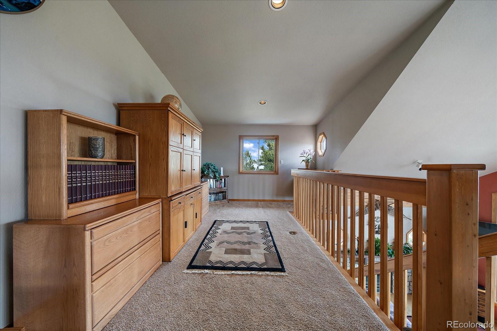 19791 Maxwell Drive Morrison, CO 80465 - Photo 25 of 50 a open kitchen with white cabinets