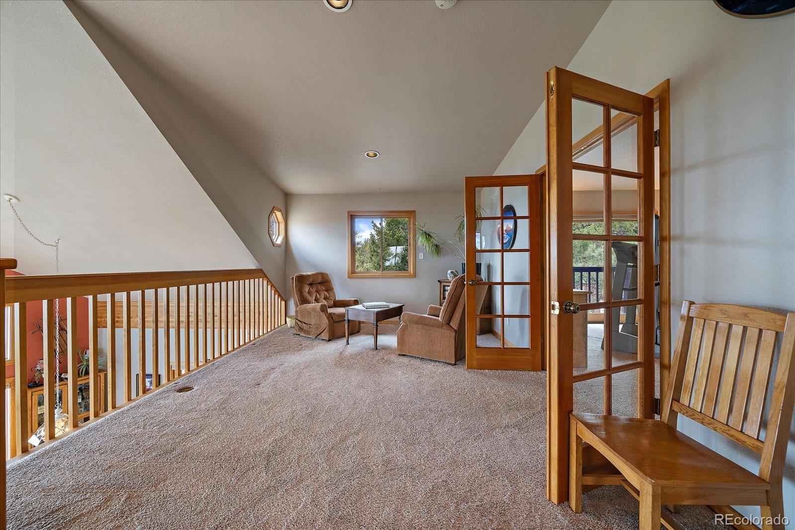 19791 Maxwell Drive Morrison, CO 80465 - Photo 27 of 50 a view of livingroom with furniture and window