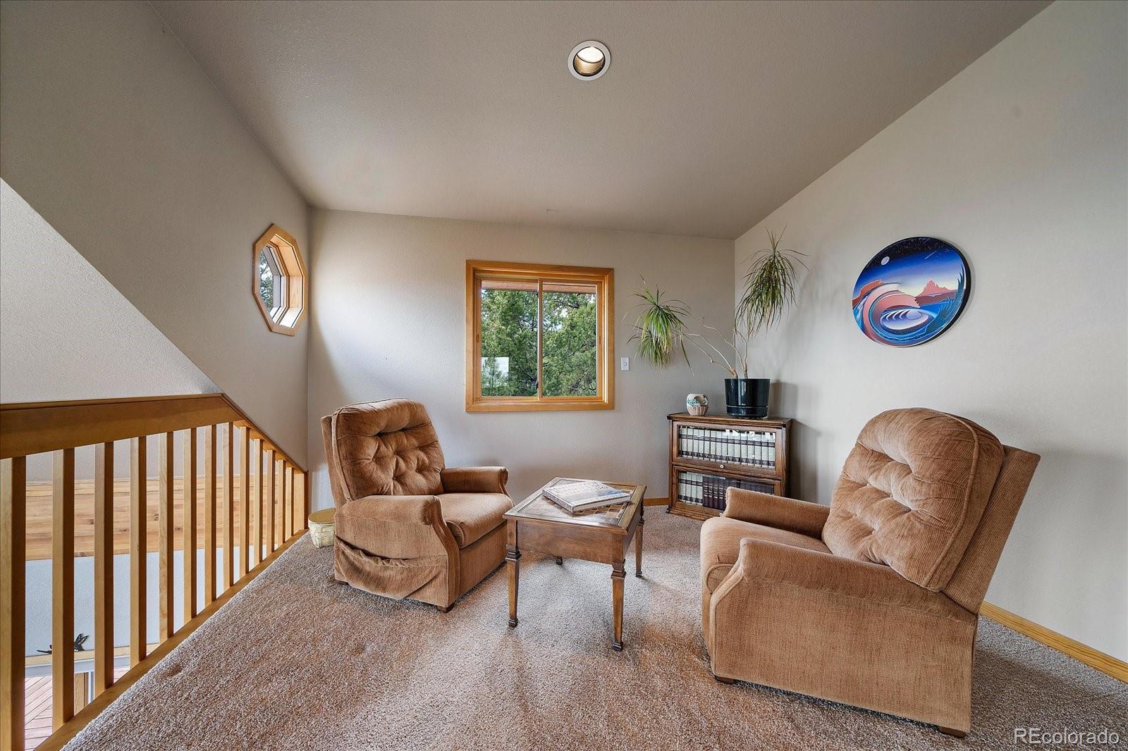 19791 Maxwell Drive Morrison, CO 80465 - Photo 28 of 50 a living room with furniture and a window